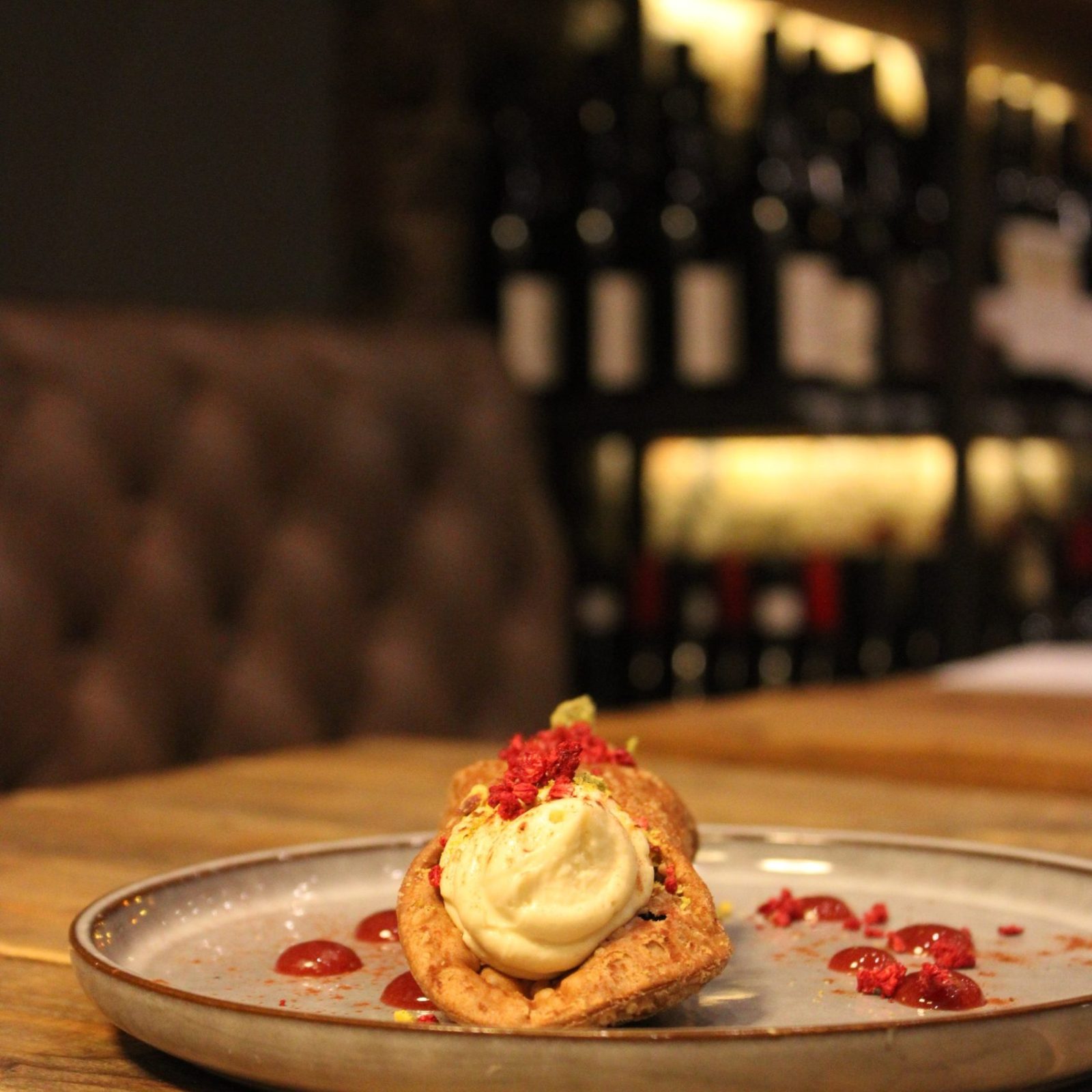 Cannolo and Wine Bottles